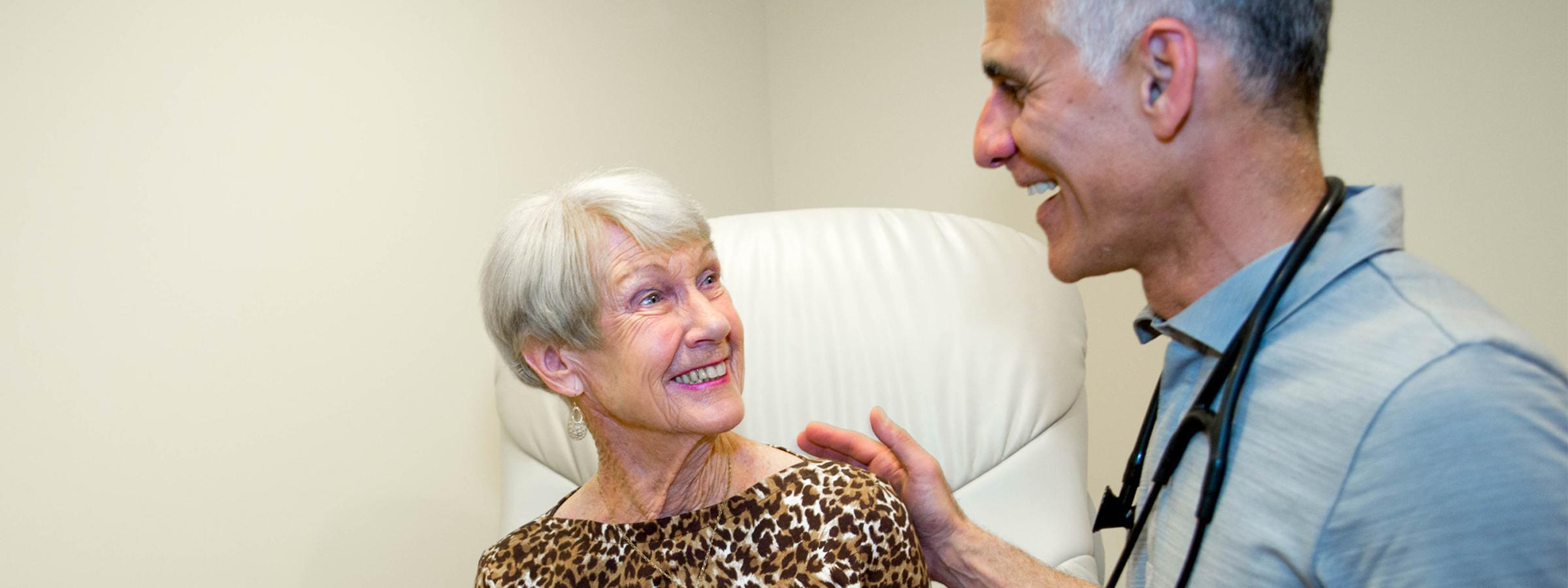 Doctor speaking with woman.