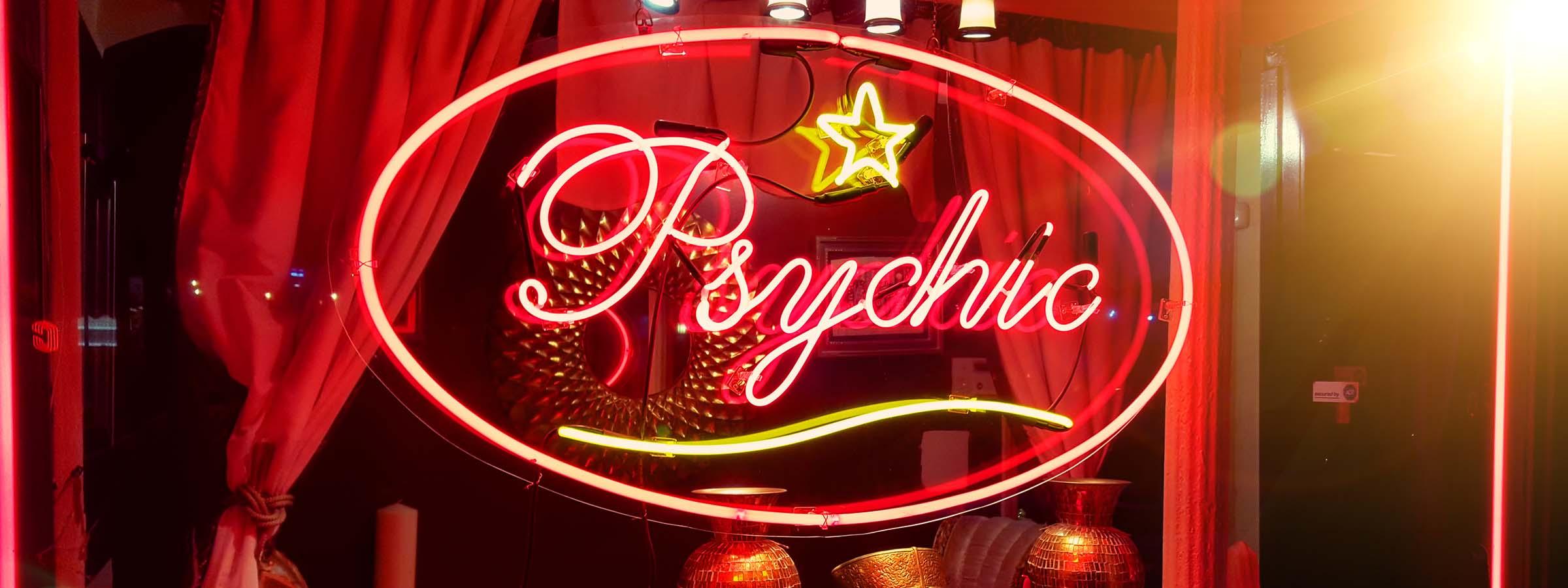 Neon sign that says "psychic".