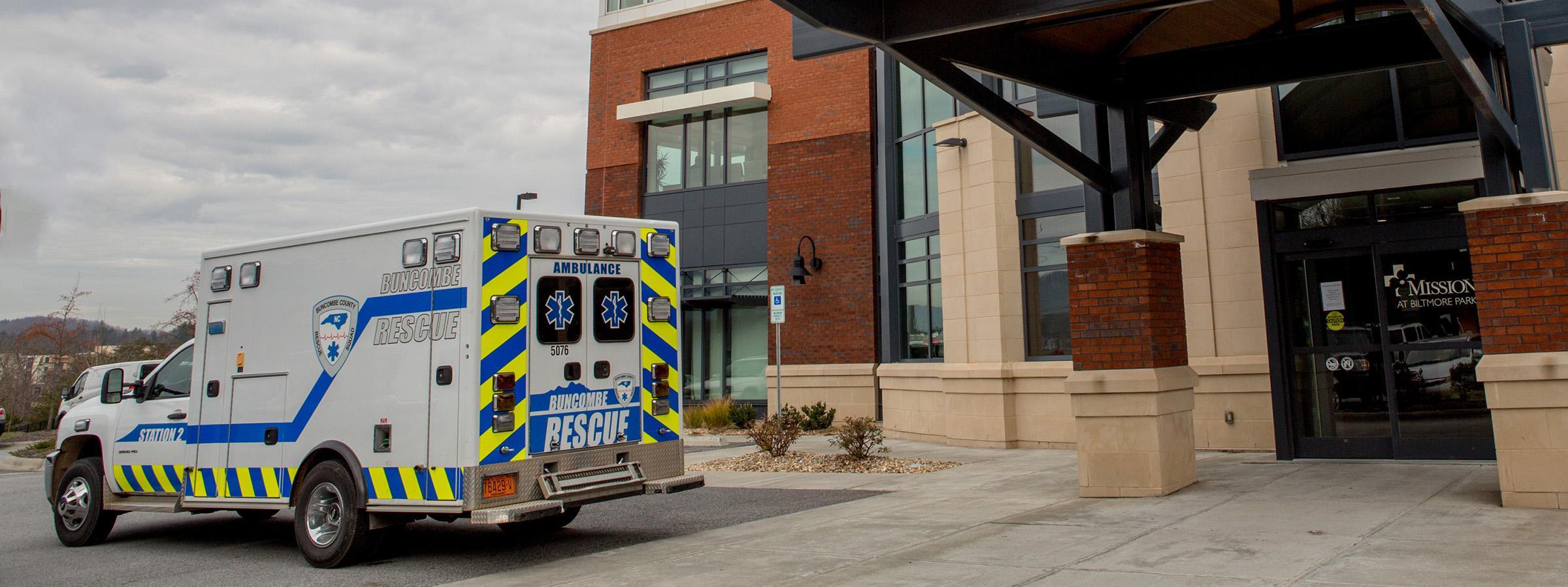 Ambulance parked outside building.