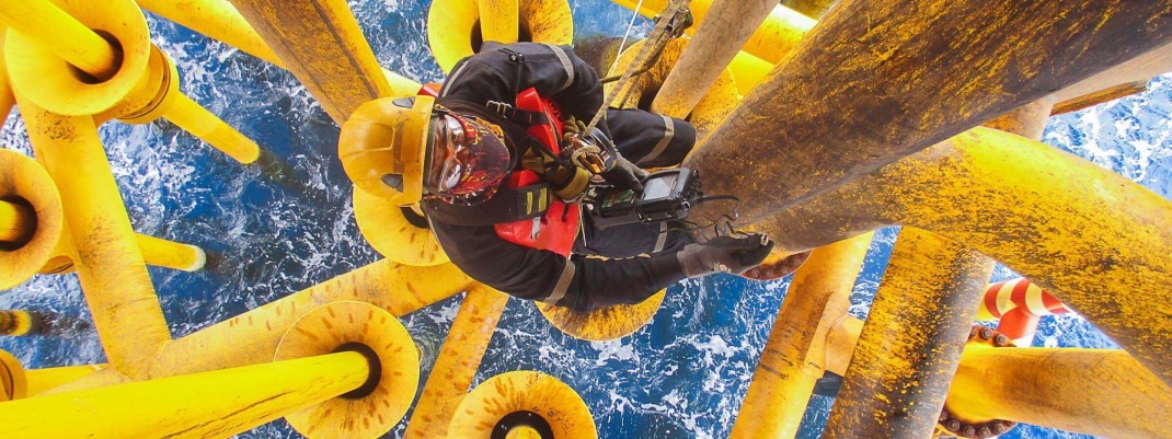 Worker scaling a telephone pole