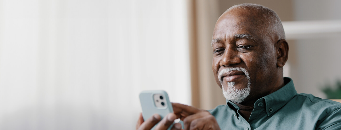 Male patient communicating with doctor office on mobile phone