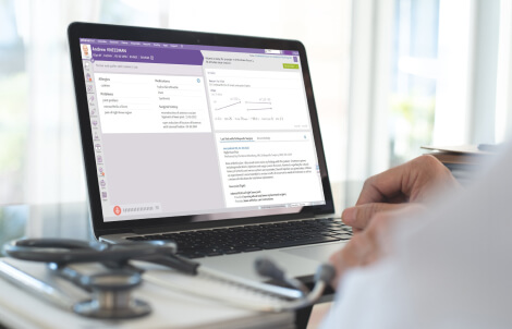 athenaOne software shown on laptop