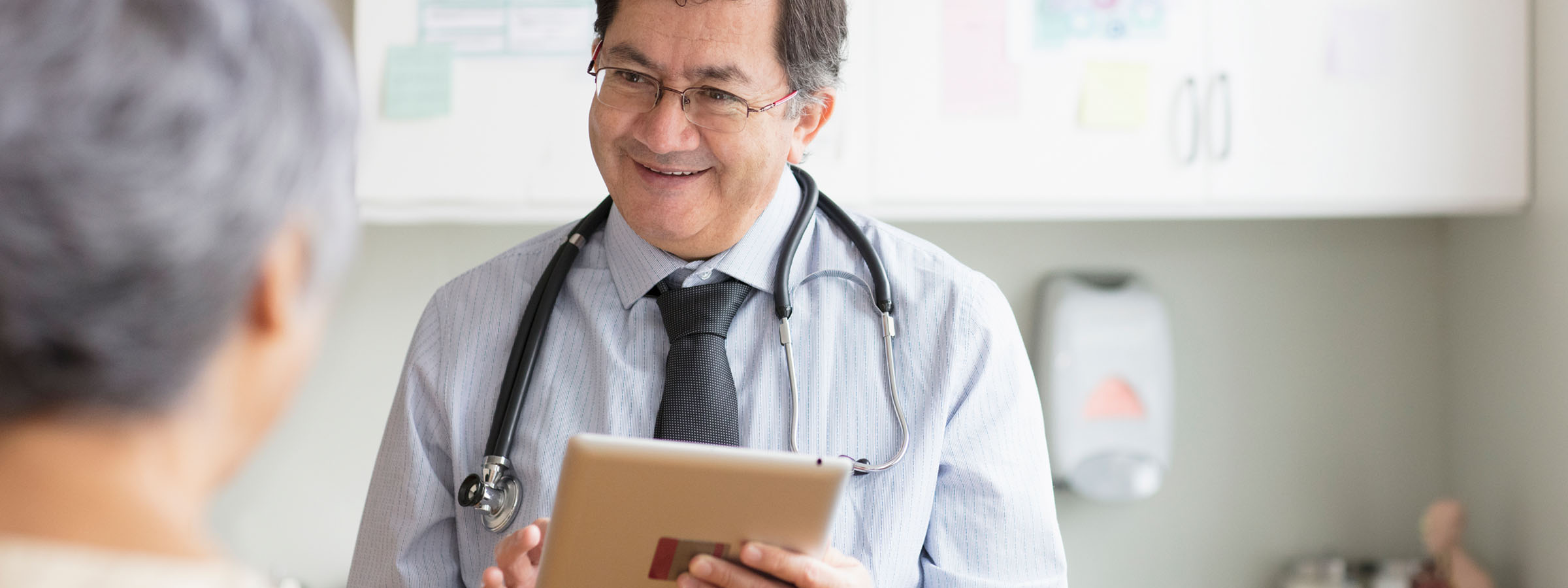 photo of physician looking at his watch