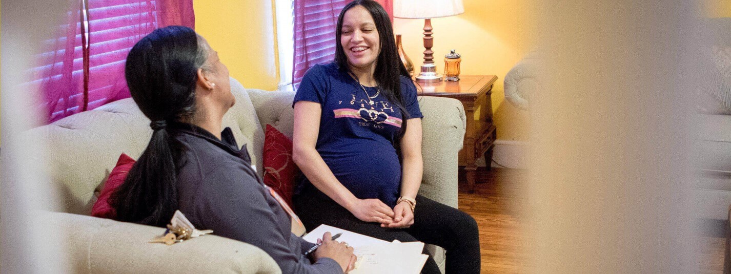 photo of a Family First Health community health worker visiting a patient at home