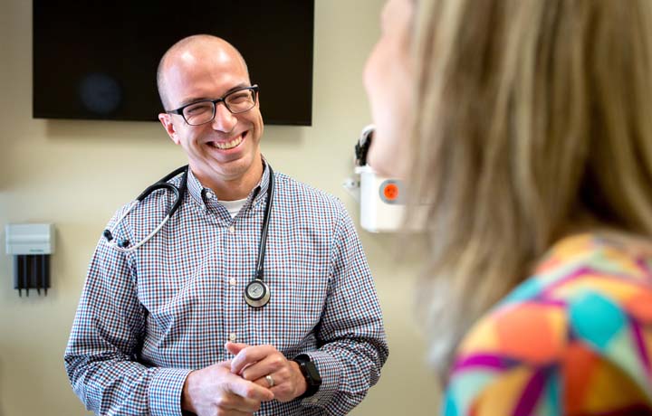 smiling doctor wearing glasses