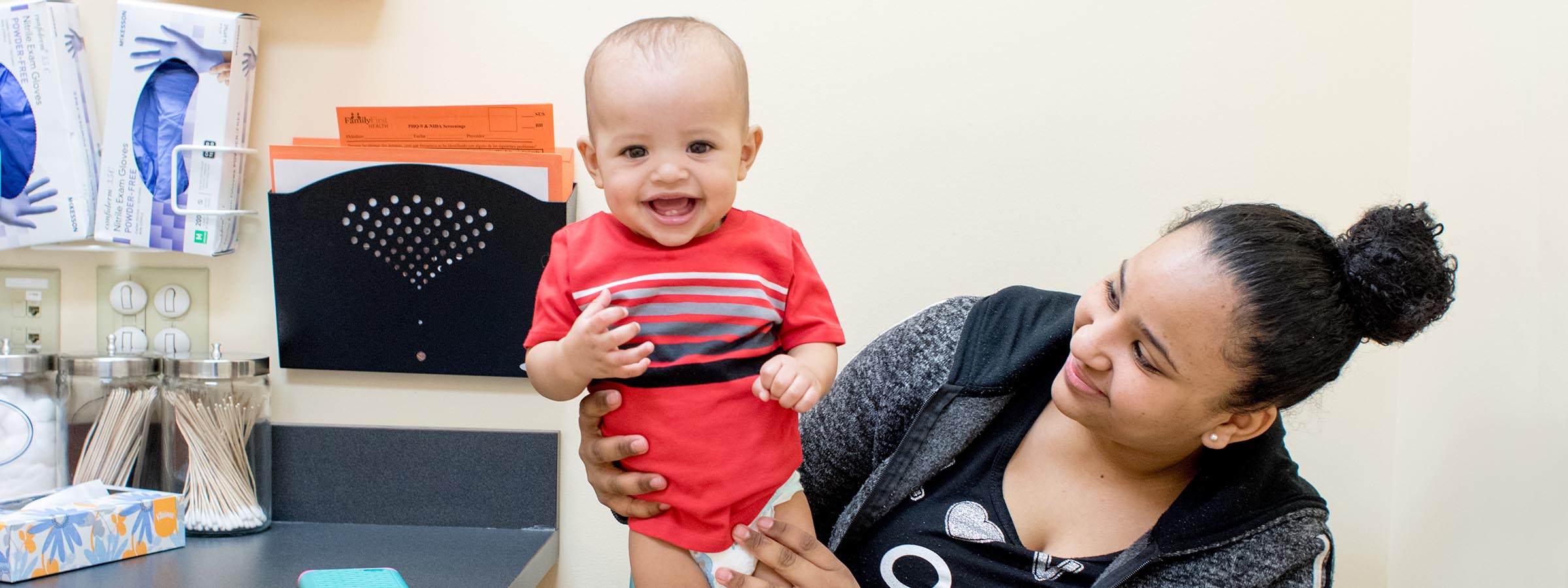 Baby smiling after doctor's checkup.