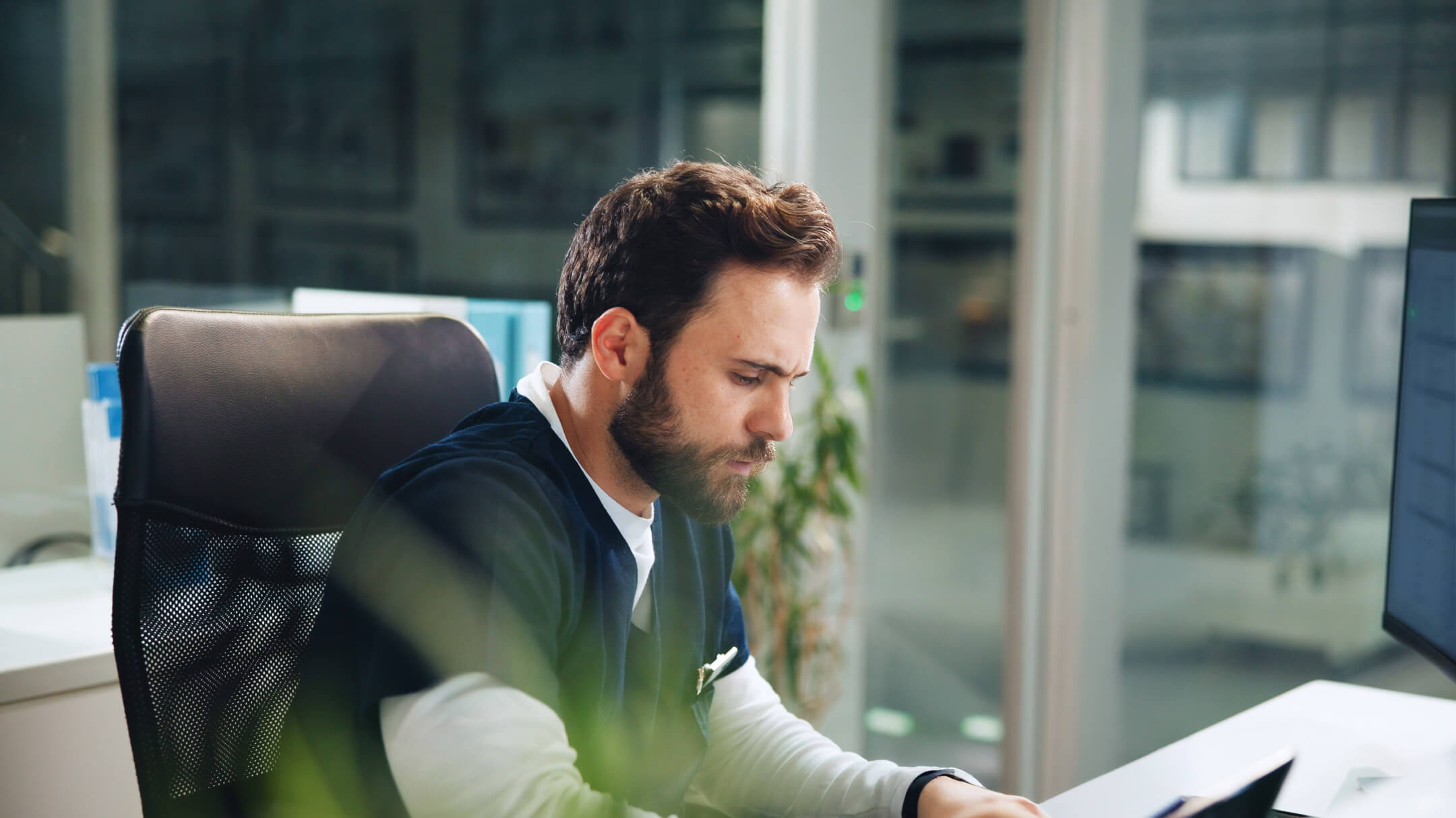 A clinician is reviewing the practice management features included in athenaOne’s Summer 2025 release.