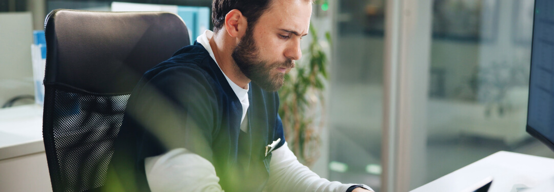 A clinician is reviewing the practice management features included in athenaOne’s Summer 2025 release.