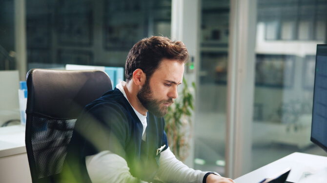 A clinician is reviewing the practice management features included in athenaOne’s Summer 2025 release.