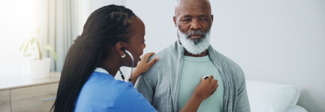 Male Medicare patient being seeing by physician.