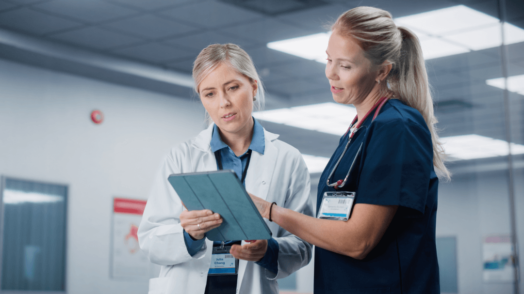 Two clinicians review the patient chart in an AI native EHR