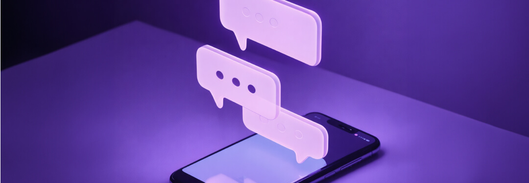 A smartphone illuminated with light purple chat bubbles, symbolizing ambient listening technology in practice.
