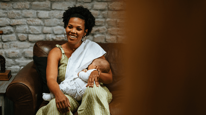  A customer embraces a baby, highlighting lactation consulting services available to Texas families.