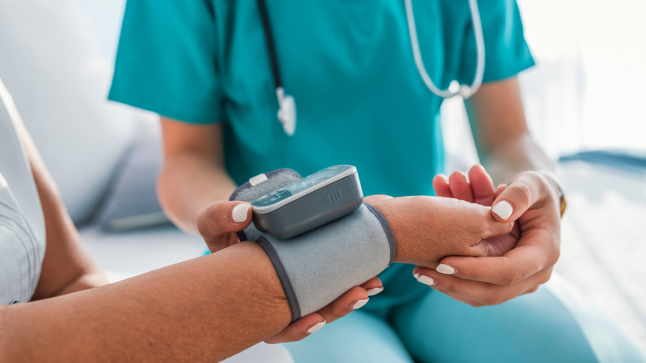 A healthcare professional checks the blood pressure of a patient, highlighting a routine medical examination.