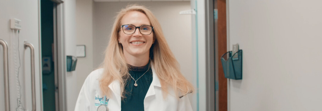 Dr. Smith, an internal medicine primary care provider, walks through the hallway of Springfield Clinic in Springfield, IL.