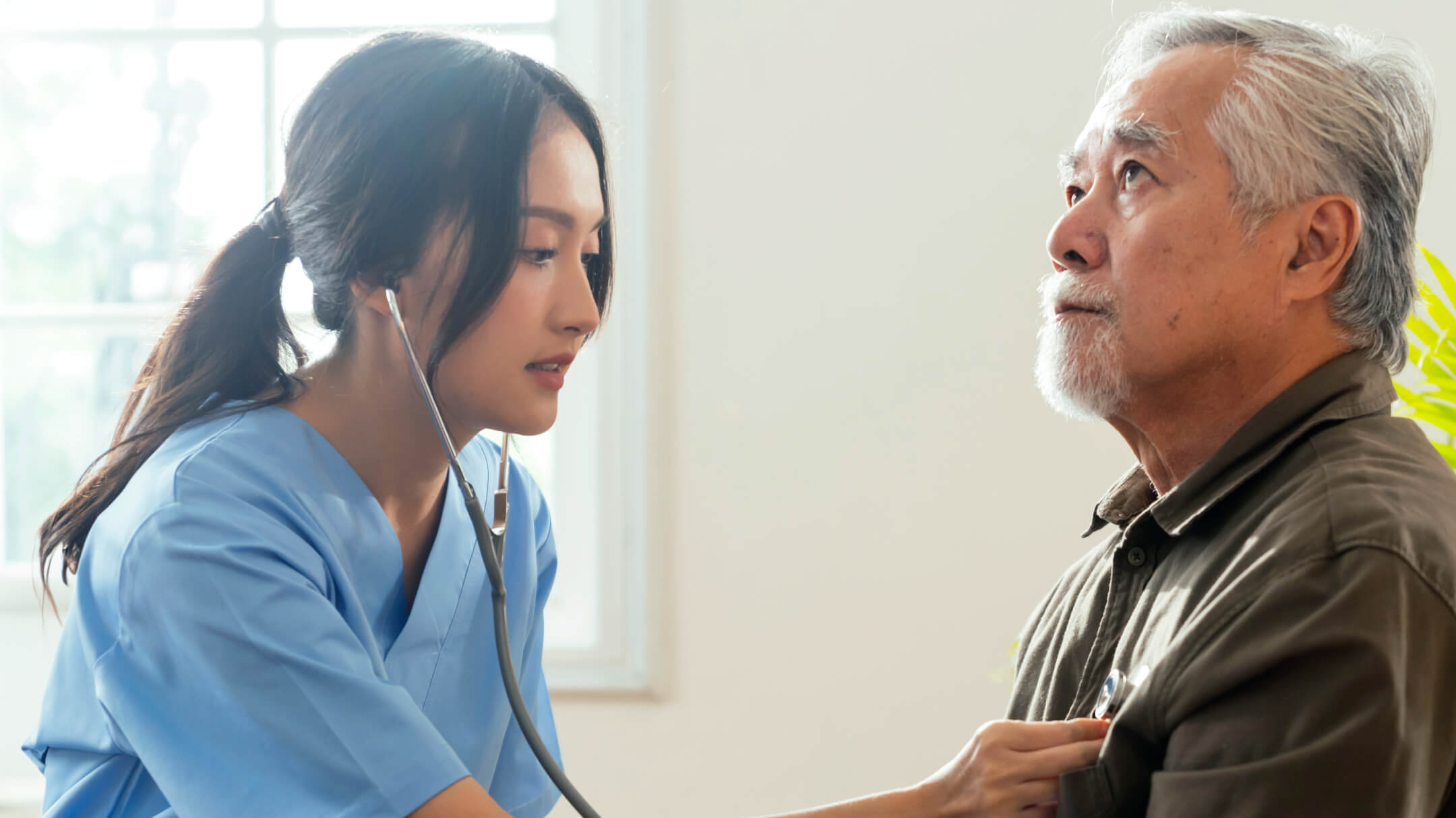 Physician monitors patient heartbeat