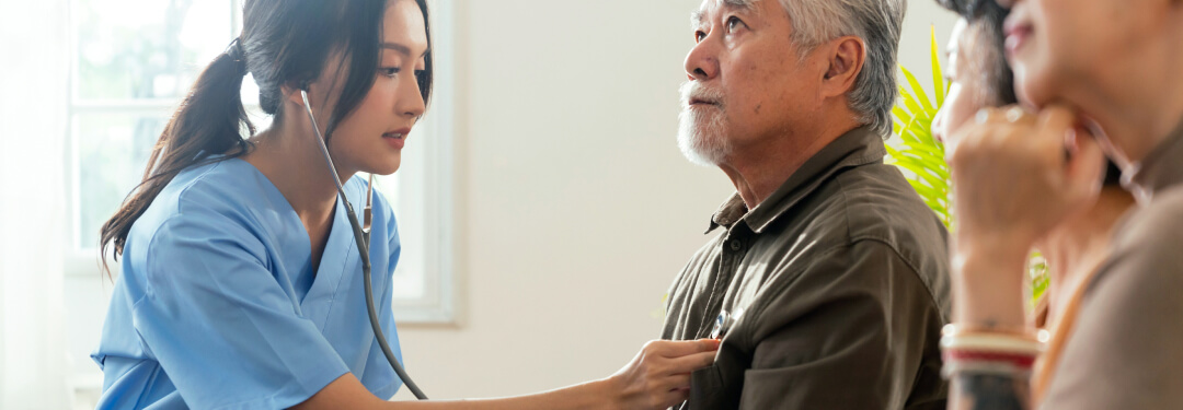 Physician monitors patient heartbeat.