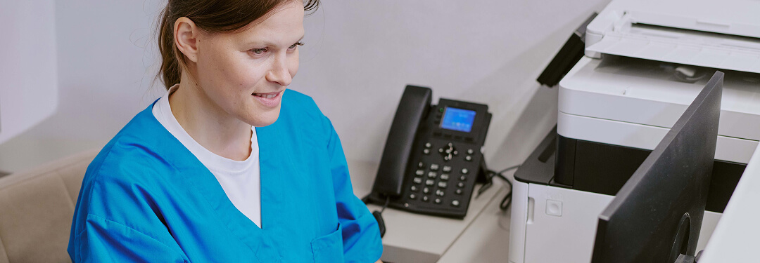 Clinician reviewing claim with AI-enabled coding for RCM before submitting.