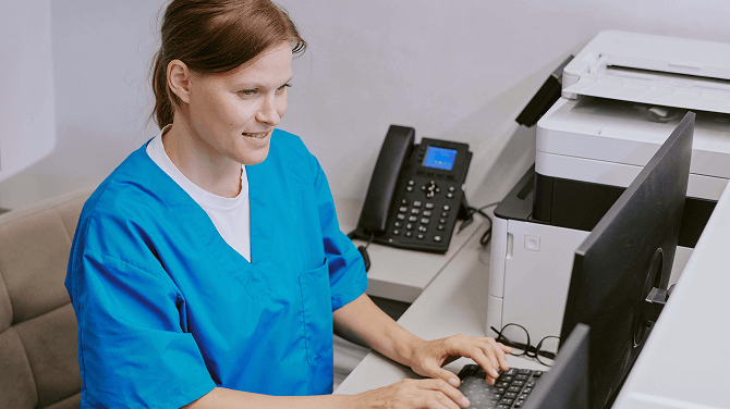 Clinician reviewing claim with AI-enabled coding for RCM before submitting.