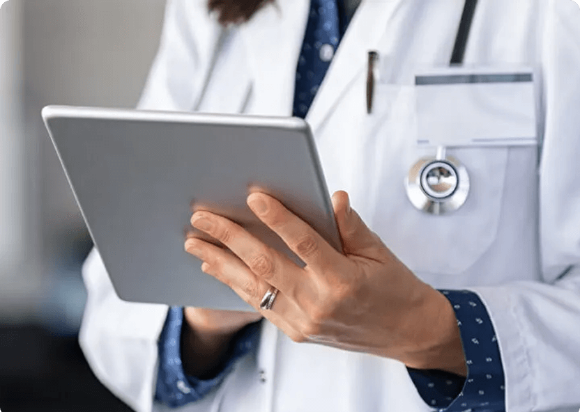 physicians hands holding a tablet