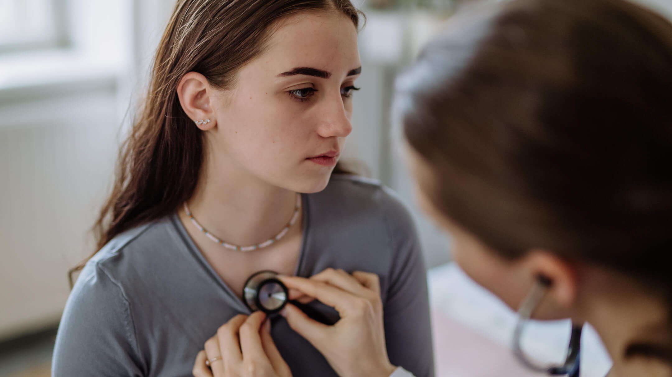 Female patient being seen by her primary care doctor