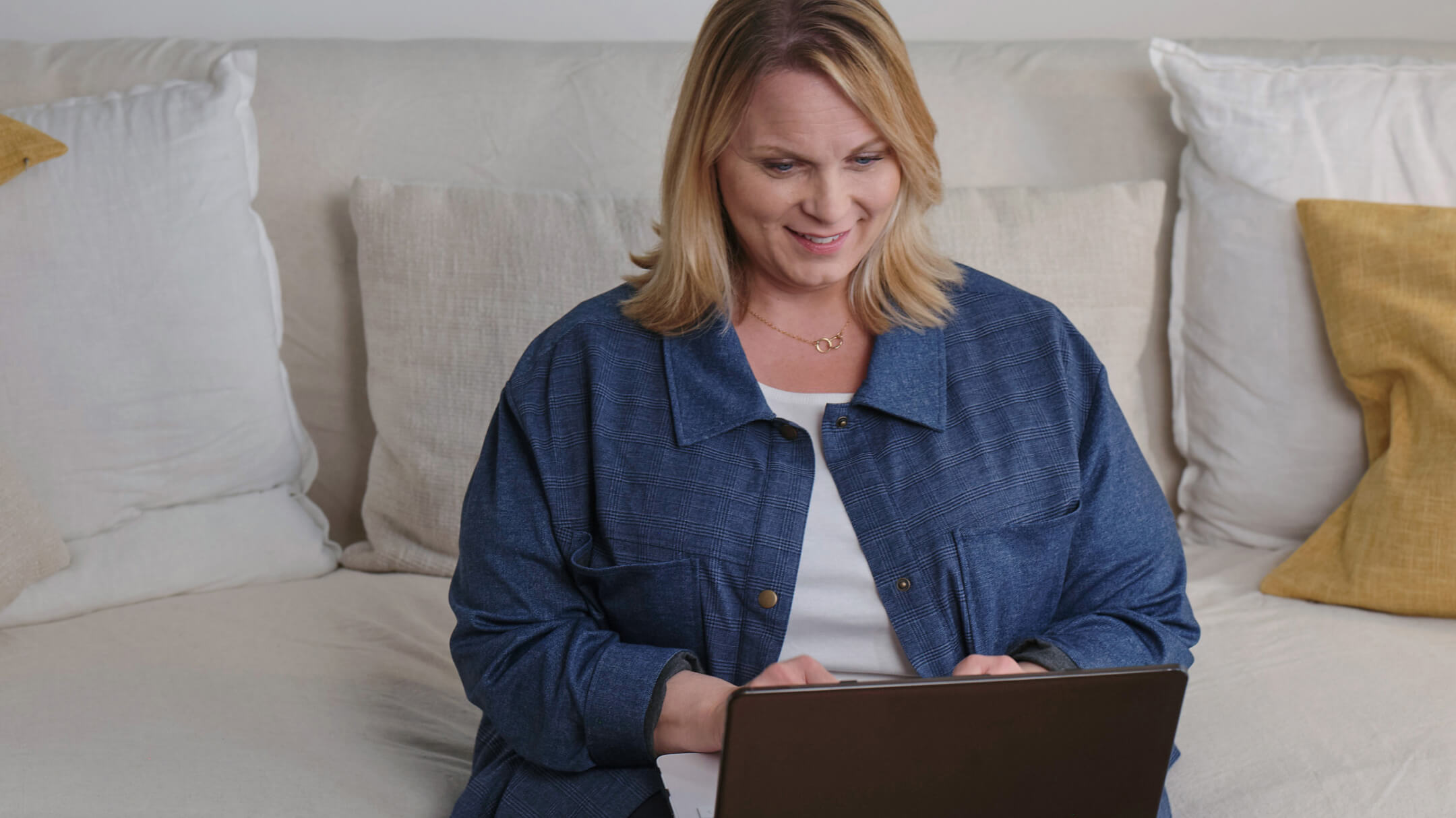 Patient at home viewing her medical records through patient portal