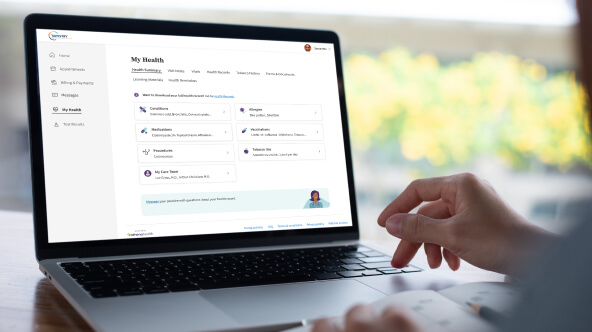 A patient accesses their patient portal and views their health summary on their laptop.