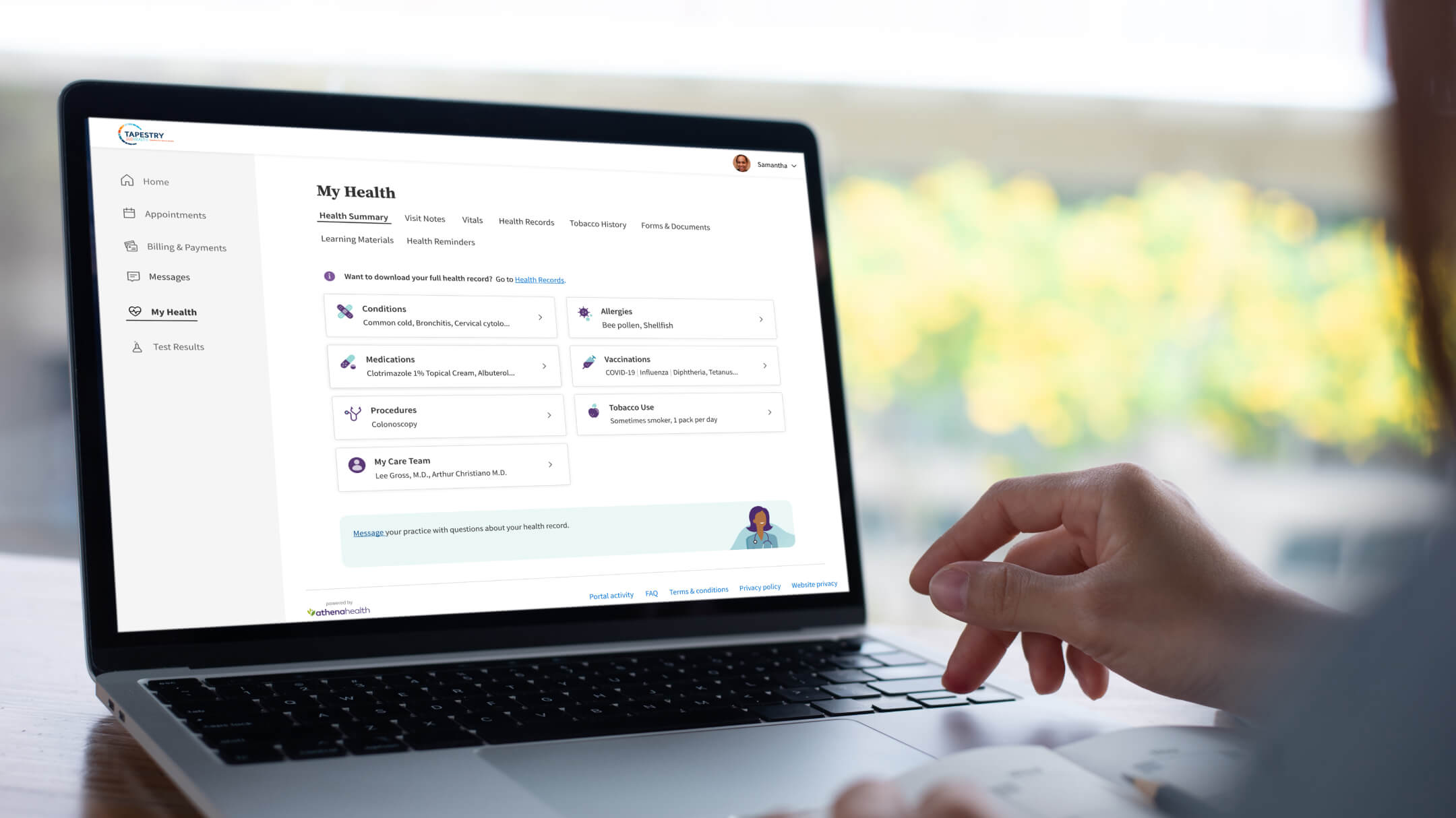A patient accesses their patient portal and views their health summary on their laptop.