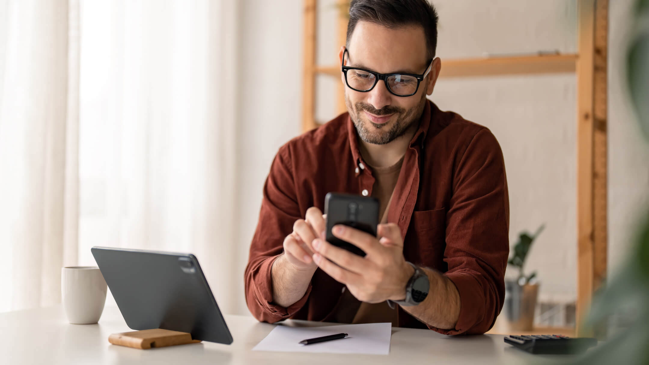 Man at home checking his patient portal, scheduling medical appointments