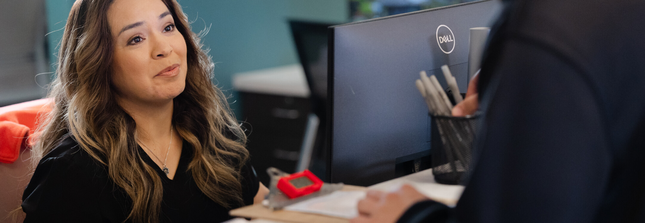  Healthcare professional addressing card on file for improving revenue cycle efficiency.