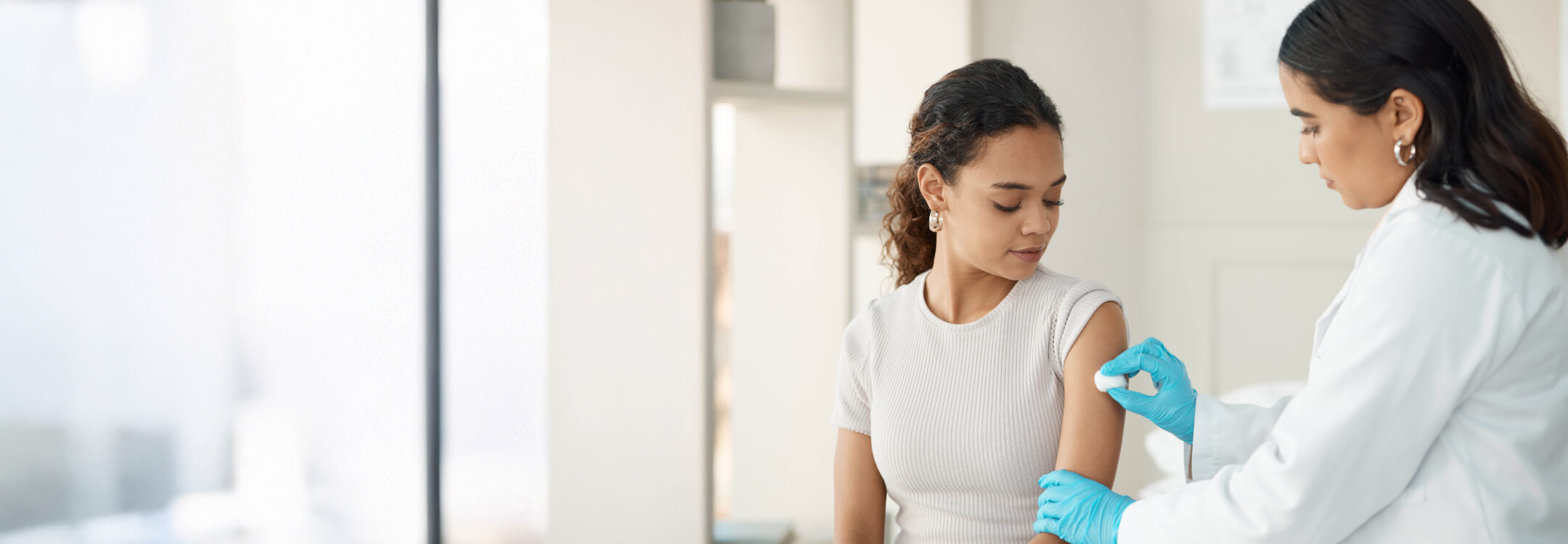 A patient receiving her seasonal vaccines by medical professional