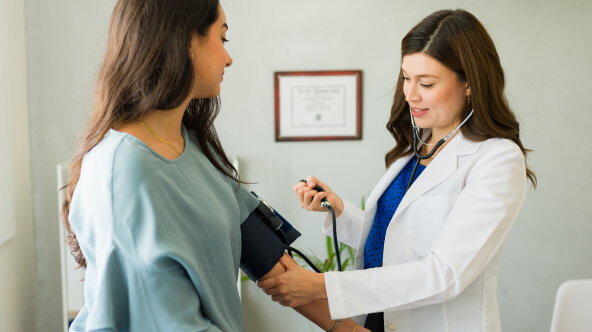 Physician working with patient during exam