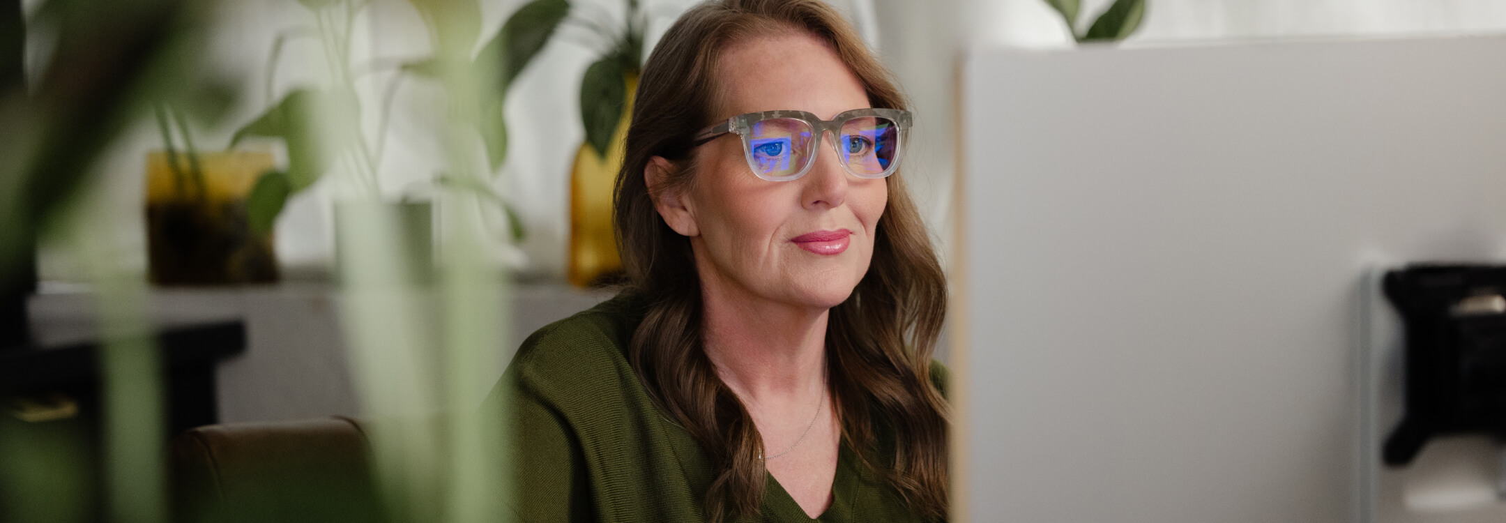 An admin gazes at a computer screen, highlighting the importance of telehealth in modern healthcare.