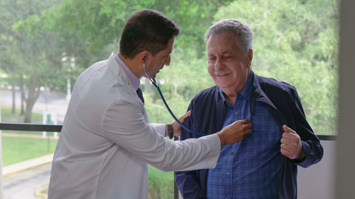 Using a stethoscope, a physician checks a patient’s heartbeat.