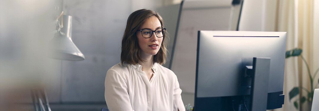 Medical biller verifies a claim submission created with AI-enabled coding.